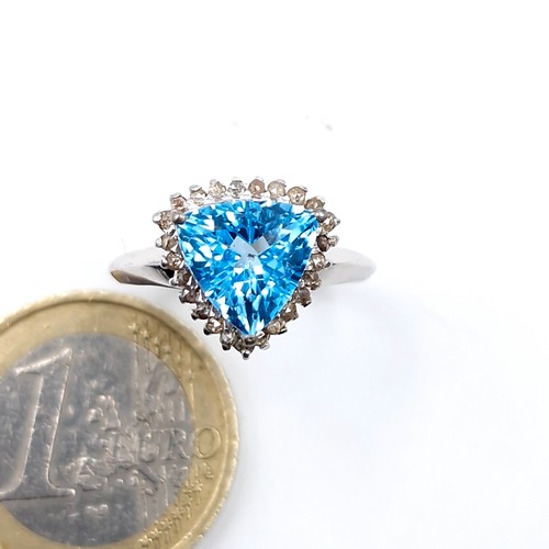 579 - A stunning blue topaz gemstone ring approx. 3ct with diamond surround set in sterling silver stamped... 