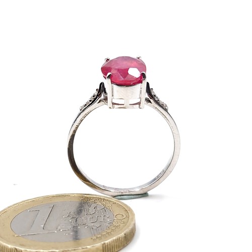 580 - A fabulous 3ct oval cut ruby gemstone ring with .10ct diamond shoulders set in sterling silver stamp... 