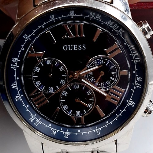 1051 - A classic gents Guess designer chronograph wristwatch with stainless steel case and original bracele... 