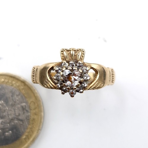 1054 - Star Lot : An attractive nine carat gold (375) gemstone set claddagh ring. Size - R. Weight - 2.8 gr... 