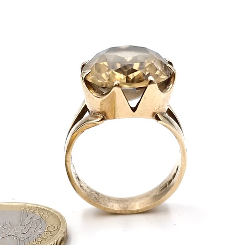 1058 - Star Lot : A very heavy fine quality nine carat gold (375) smoky quartz stone ring set in a crown cl... 