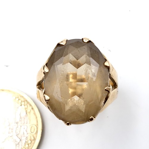 1058 - Star Lot : A very heavy fine quality nine carat gold (375) smoky quartz stone ring set in a crown cl... 