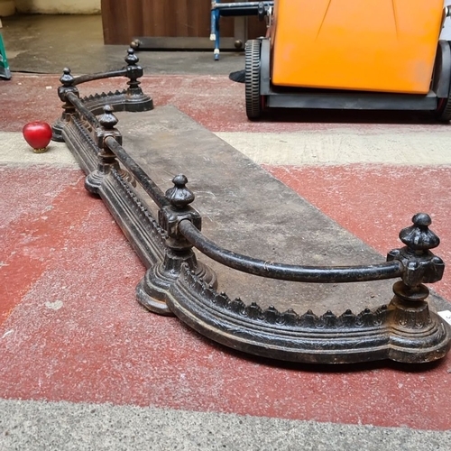 314 - Victorian cast iron fireplace fender with ornate detailing, from the late 19th century with coal cat... 