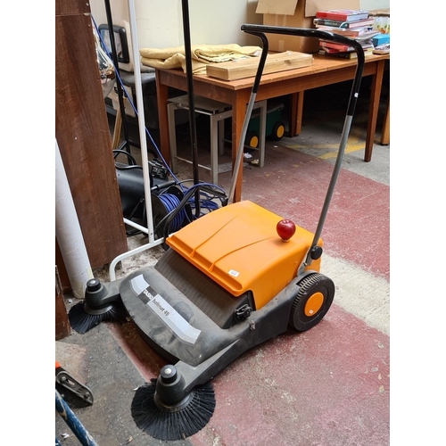 315 - TASKI Balimat 45 is a manually operated floor sweeper with dual side brushes and a durable design.