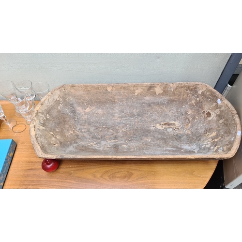 323 - A large antique Hand-carved rustic wooden dough trough, exhibiting natural patina.