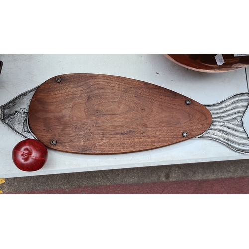 331 - Wood and pewter fish-shaped cutting board, featuring intricate metal detailing at head and tail.