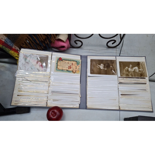 333 - A good Collection of early postcards in a grey album, Mostly late 19th, early 20th cnetury, featurin... 