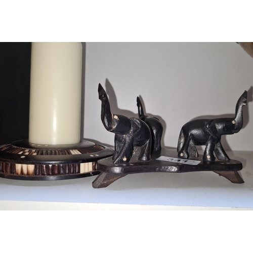 341 - A lovely pair of porcupine carved elephant trio with decorative candle holder, featuring intricate i... 