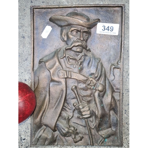 349 - A very heavy Bronze relief sculpture depicts a man in period attire with a hat and distinctive moust... 