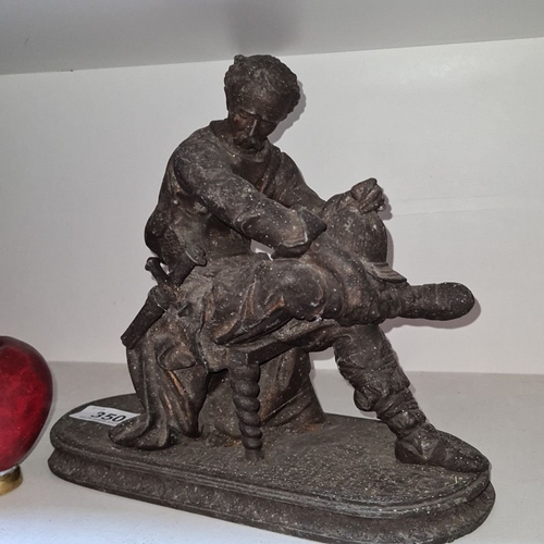 350 - Bronze sculpture depicting a barber performing surgery, featuring detailed attire. From the 19th cen... 