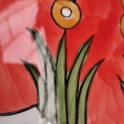 351 - An After Clarice Cliff hand-painted pitcher from the 