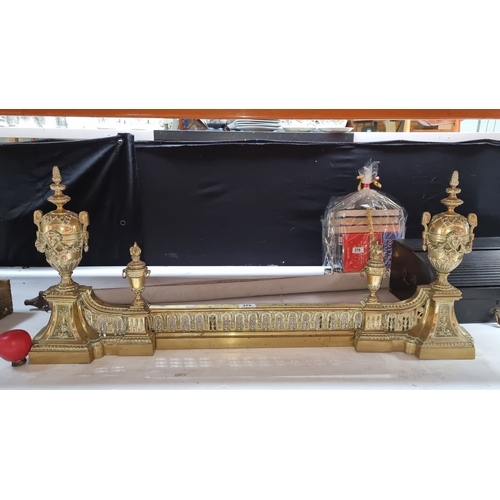 375 - Star Lot : A fabulous Gilt brass neoclassical fireplace fender with urn finials and intricate relief... 