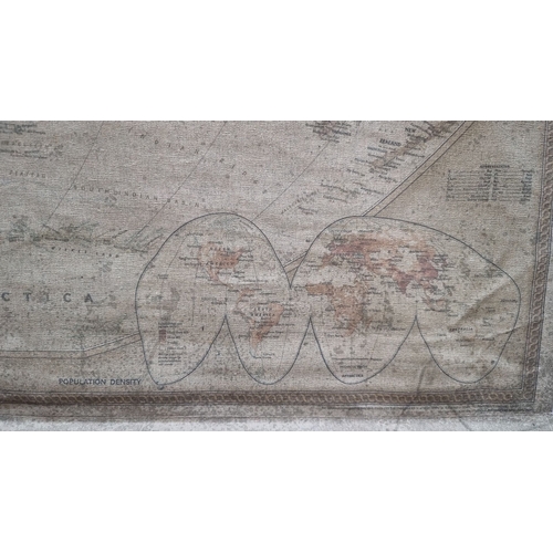 377 - A large Vintage school house  world map wall hanging, detailed cartography on canvas with wooden dow... 