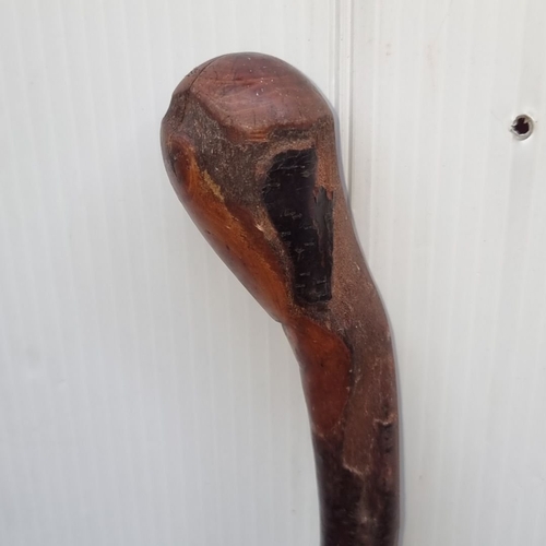 380 - A blackthorn  wood walking stick with a unique grain pattern. Length approximately 36 inches.