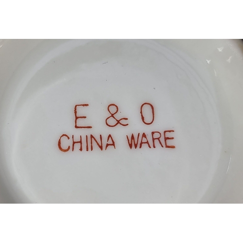 395 - E&O China Ware tea set features hand-painted Asian landscape motifs. The set includes a teapot, suga... 