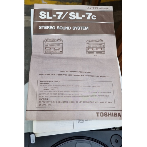 410 - Toshiba Stereo Sound System Model SL-7, featuring dual cassette decks and turntable, complete with s... 