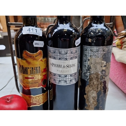 411 - Three bottles of wine, including Moldovan Vin Dulce Rosu and two St Pierre de Serjac from France, ho... 