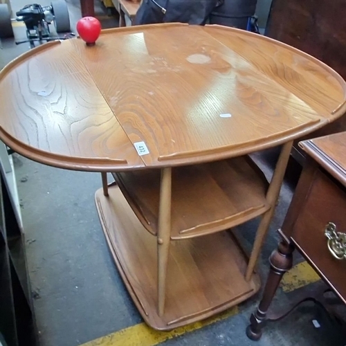 432 - Mid-Century Modern oak drop-leaf serving trolley with two shelves on casters, from the 1960s.