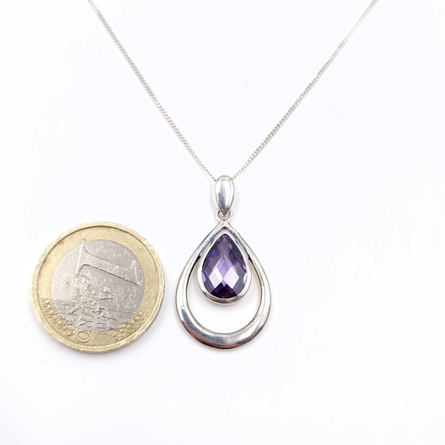 515 - An Amethyst stone pendant together with sterling silver chain. Length of chain - 44 cms. Boxed.