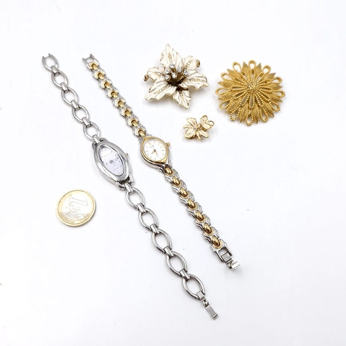 517 - A collection of jewellery items consisting of ladies watches and two brooches with pins intact. As p... 