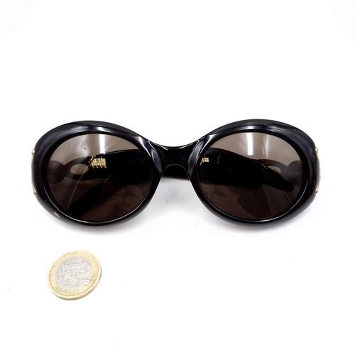 518 - A pair of original designer Burberry sunglasses. Lenses in good, clean condition.