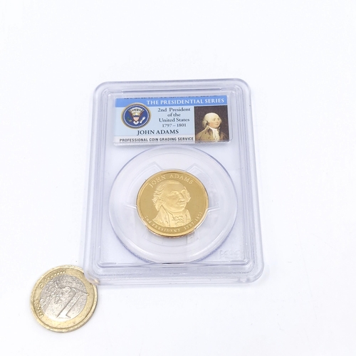 528 - An encapsulated graded coin of the Presidential series 'John Adams'. Presidential series.