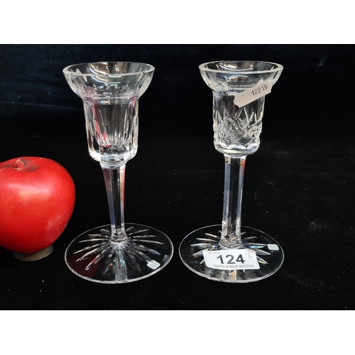 124 - An elegant pair of Waterford Crystal candlesticks. Both in excellent condition retaining acid marks ... 