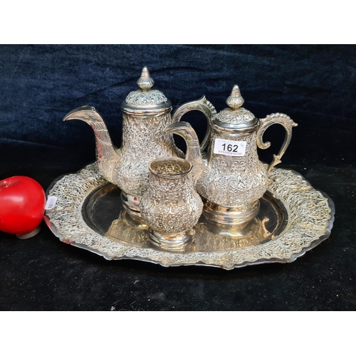 162 - A very attractive Repousse silver plate set including coffee and teapot, creamer jug and tray. All s... 