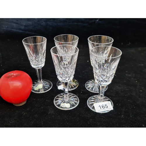 165 - Five Waterford Crystal stemmed glasses in the Lismore pattern. All in good condition with acid marks... 