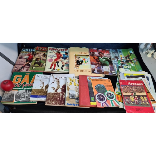 171 - A mixed lot of GAA football / sporting interest items including books, a soccer scrap book and 1970'... 