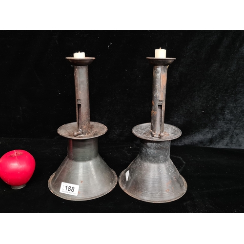 188 - A pair of metal, Spring loaded push up candle sticks. Great look and with a spring mechanism that ke... 