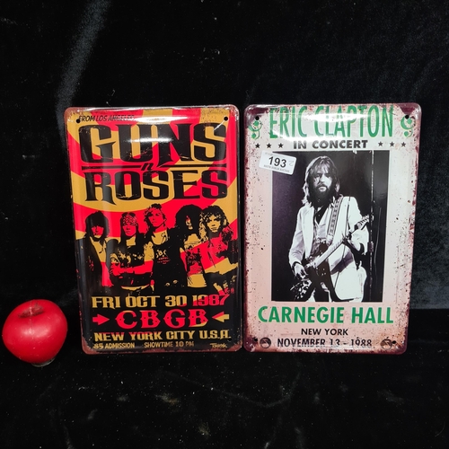 193 - Two printed metal wall signs including Guns & Roses and Eric Clapton in concert.