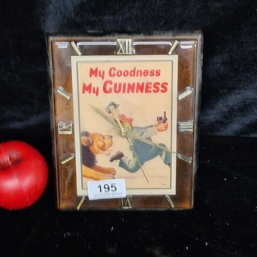 195 - A handsome battery operated wall clock advertising Guinness includes the famous Guinness zookeeper a... 