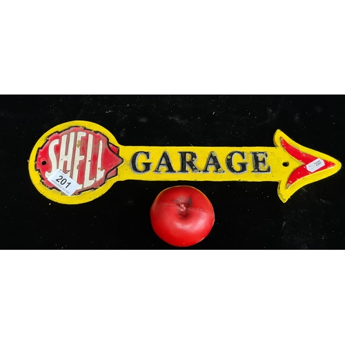 201 - A heavy cast metal painted metal wall sign reading 'Shell Garage. In the shape of an arrow.