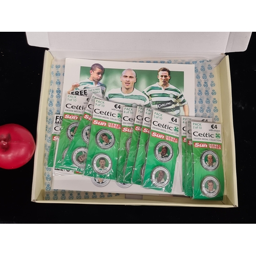 203 - A complete collection of 10 packs of Celtic 2003/04 medals including four extra edition medals. Lot ... 