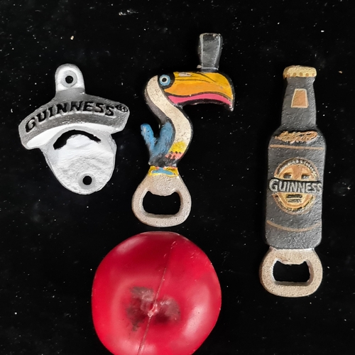 208 - Three painted cast metal Guinness bottle openers.