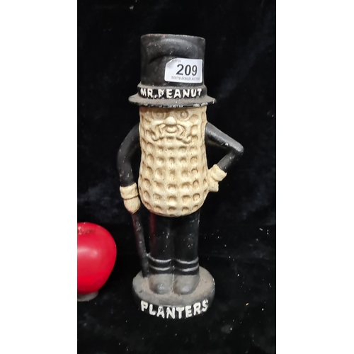 209 - A heavy painted cast iron money box in the form of Planters Mr. Peanut.