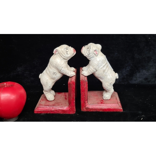 210 - A pair of painted cast iron bookends in the form of bulldogs.