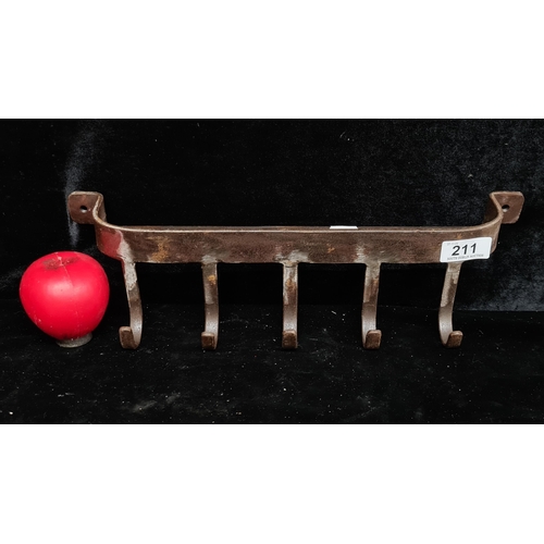 211 - A wall mounted metal rack with hooks. Could be used as a kitchen spice and utensil holder or as coat... 