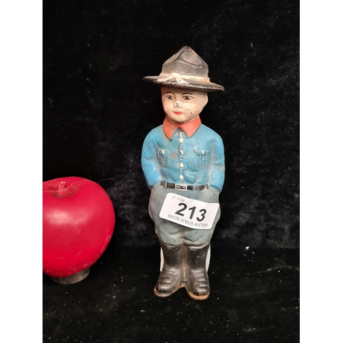 213 - A heavy cast iron money box in the form of a USA order guard.