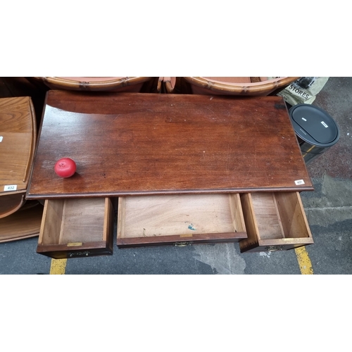 437 - Star Lot : Antique mahogany desk with three drawers and ornate brass handles, featuring turned legs ... 