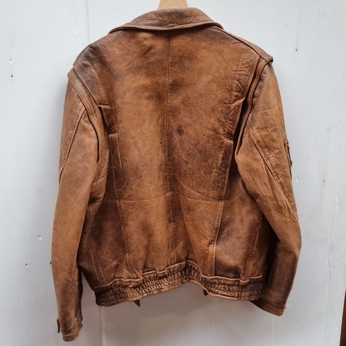 451 - Vintage brown leather jacket with multiple pockets and a soft lining, featuring a classic design wit... 