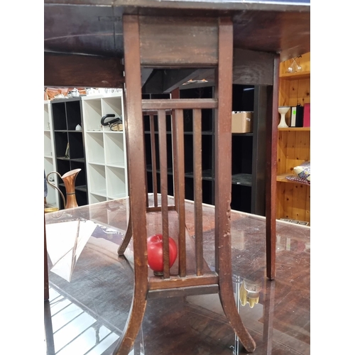 456 - A very handsome Mahogany drop-leaf side table, early 20th century. Features slatted supports, lower ... 