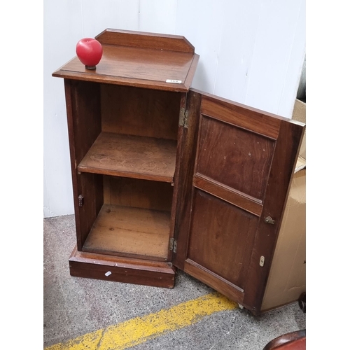 464 - Antique oak cabinet with carved floral motif, featuring single door and interior shelf. Early 20th-c... 