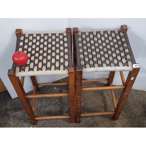 468 - Pair of oak Arts and Crafts stools with woven seats.