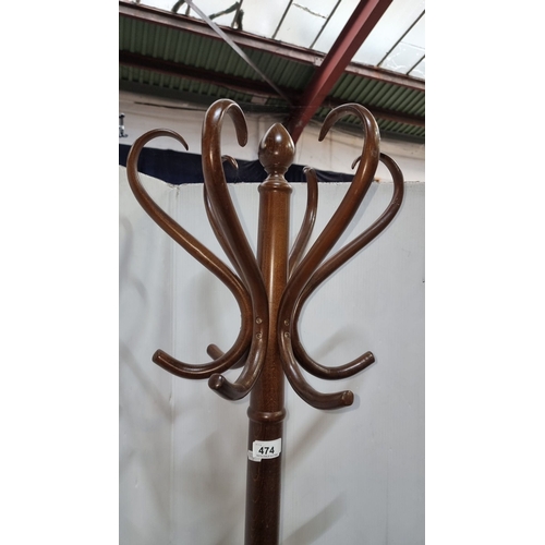 474 - Vintage wooden coat rack, bentwood design. Features intricate curved hooks.