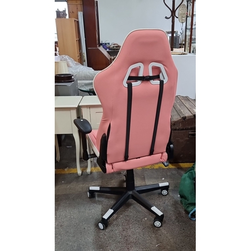 489 - Nokaxus gaming chair in pink and white, featuring ergonomic design, adjustable armrests, and swivel ... 