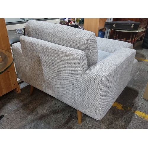 496 - Star Lot : Modern gray fabric armchair with matching  ottoman, featuring sleek lines and contemporar... 