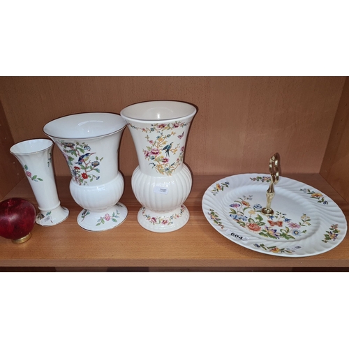 604 - Set of four Wicklow Vale ceramic items feature floral and bird motifs. Includes two vases and a two-... 