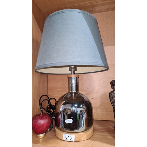 606 - Chrome and wood table lamp with a blue fabric shade, model 508693, from IRL. Modern design with warm... 